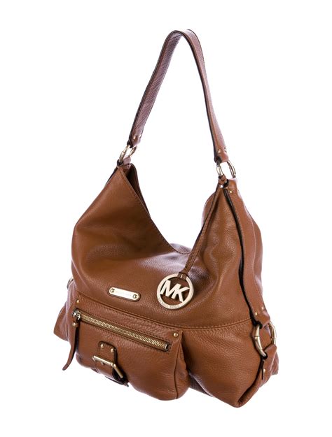 are michael kors bags made of leather|is Michael Kors real leather.